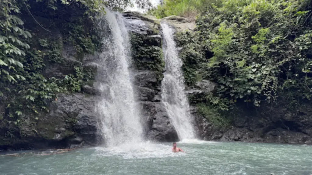 Swimming at Juwuk Manis Waterfall
